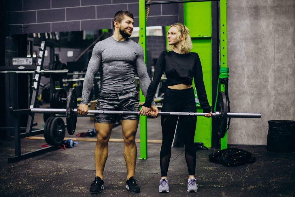 Couple training together at the gym